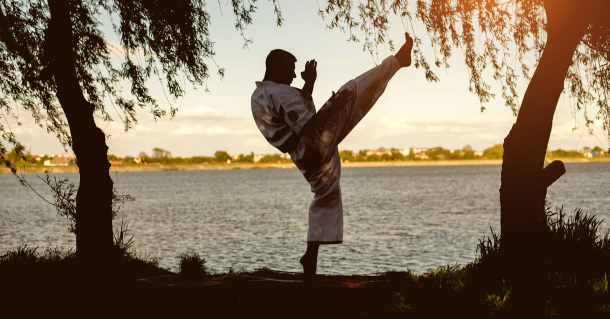 Practicing karate at sunset Practicing karate at sunset