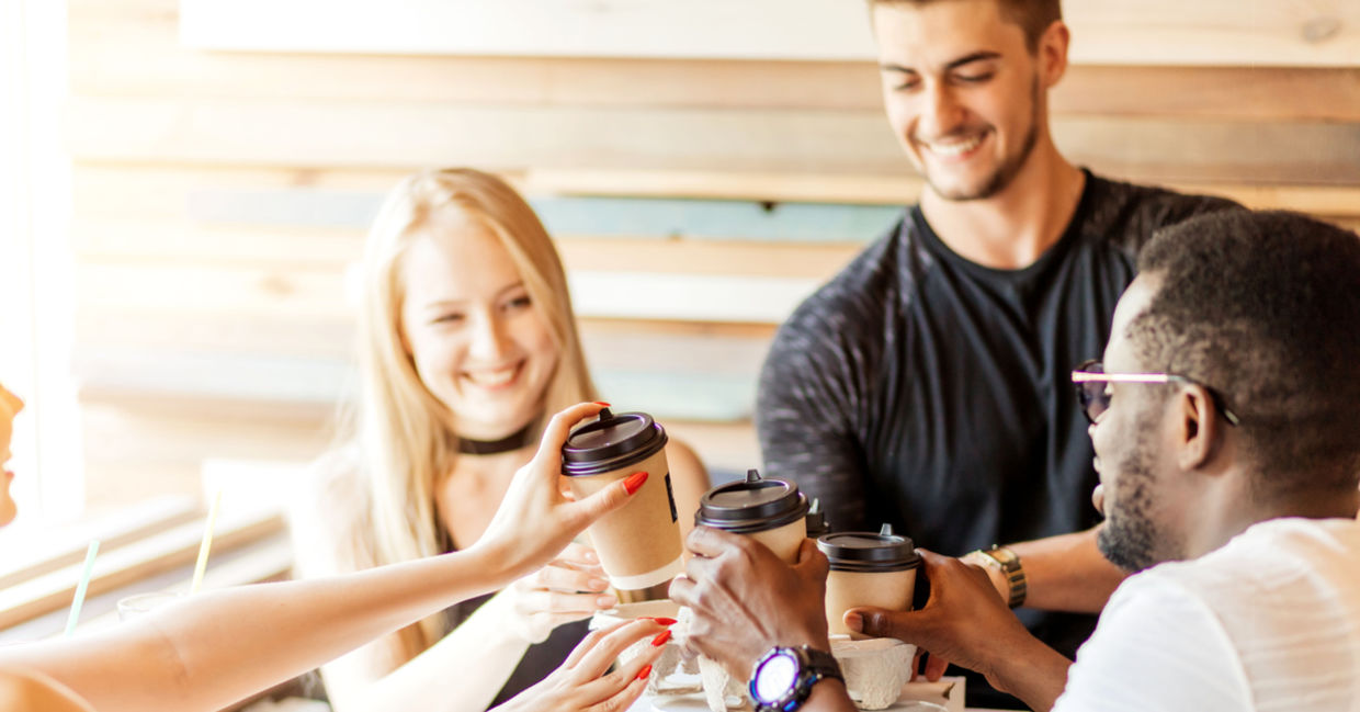 Colleagues sitting and meeting with coffee cups in their hands. Colleagues sitting and meeting with coffee cups in their hands.