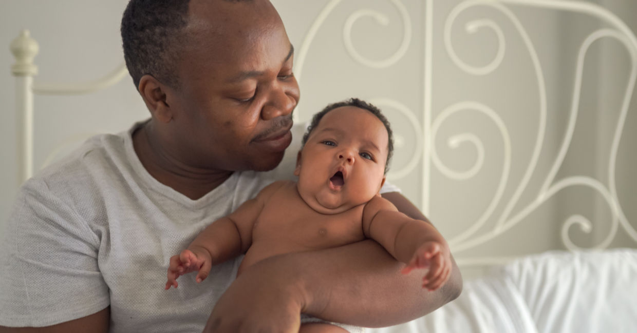 A father hugs his baby. A father hugs his baby.