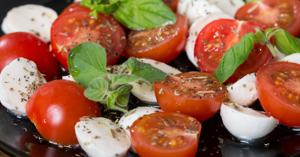 Italian Caprese salad with a mix of tomatoes and low-fat mozzarella Italian Caprese salad with a mix of tomatoes and low-fat mozzarella