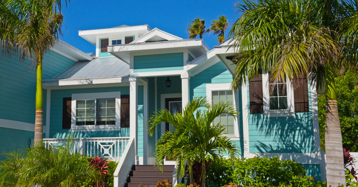 Palm trees are part of this Florida home’s landscaping. Palm trees are part of this Florida home’s landscaping.
