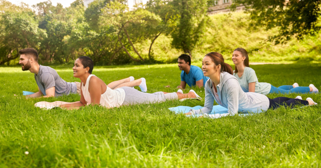 Yoga class doing the sphinx pose. Yoga class doing the sphinx pose.