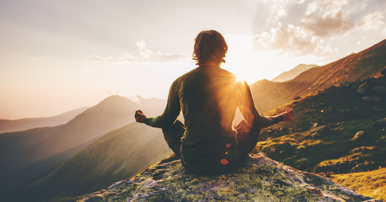 Man meditating outdoors. Man meditating outdoors.