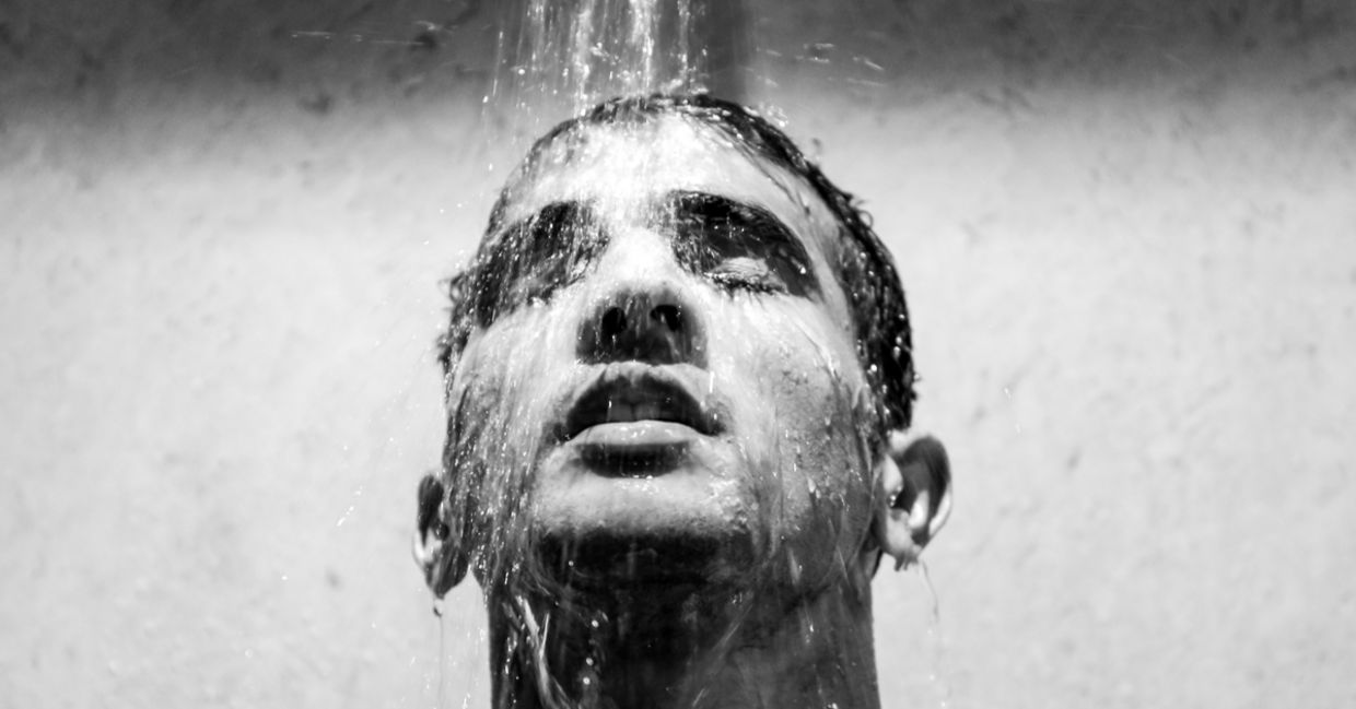 A man enjoying a refreshing cool shower A man enjoying a refreshing cool shower