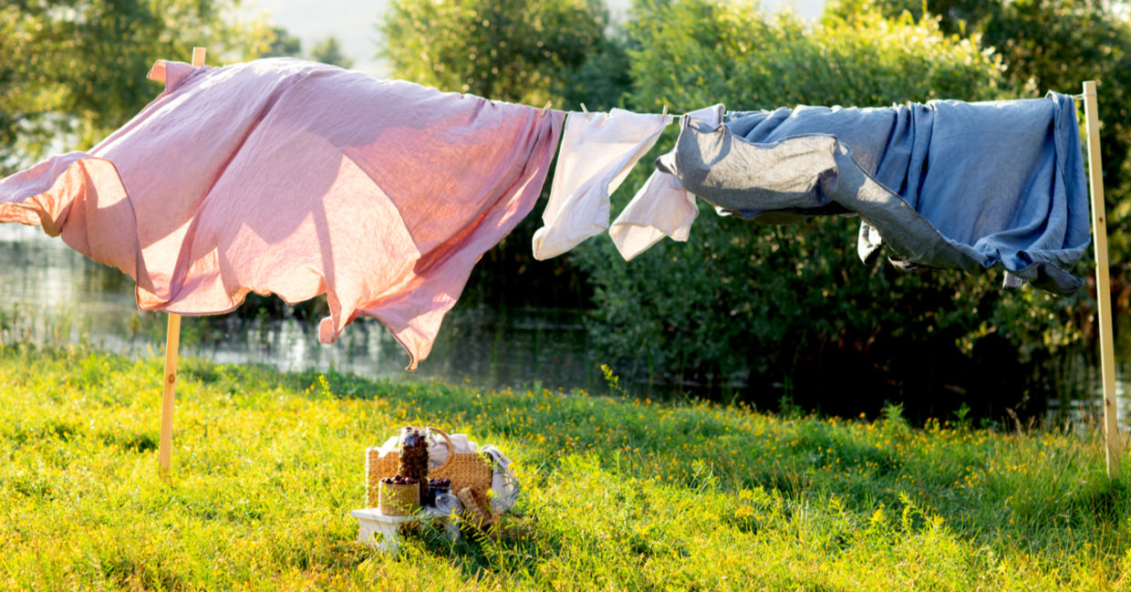 Natural bedding sheet drying under the warm sun Natural bedding sheet drying under the warm sun