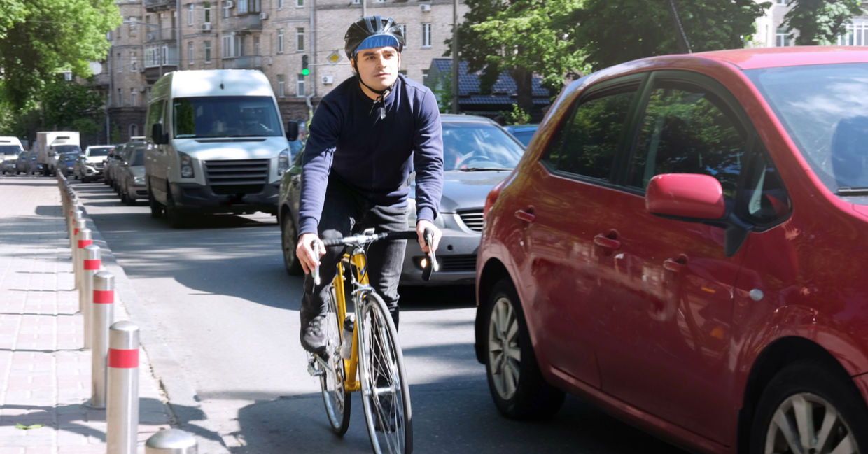 Man riding bicycle in the city.