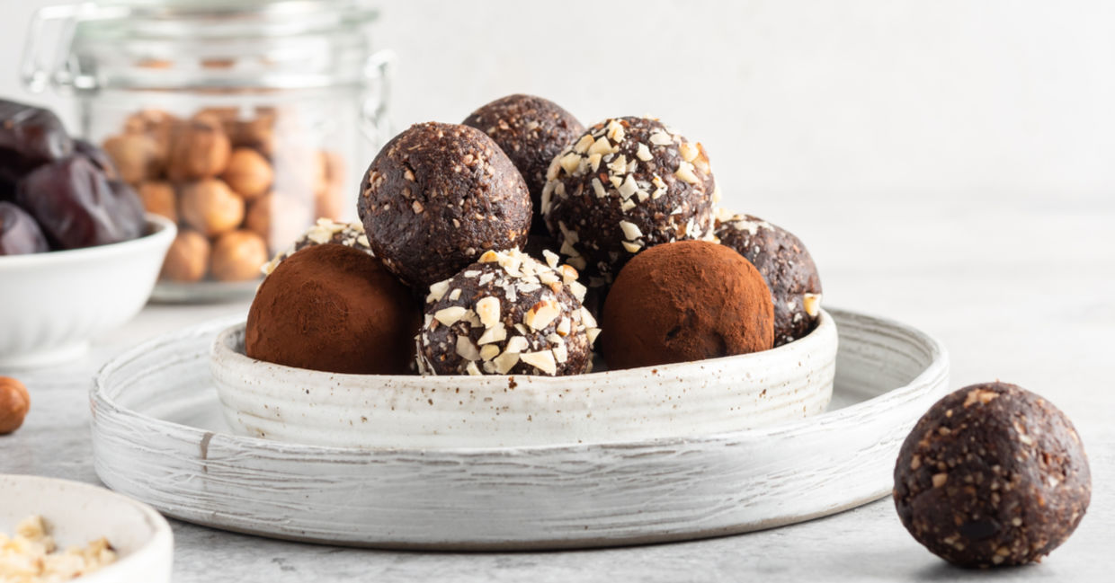 A plate of raw date balls. A plate of raw date balls.