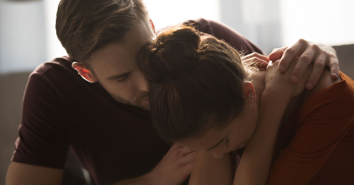 Tender man hugging stressed partner Tender man hugging stressed partner