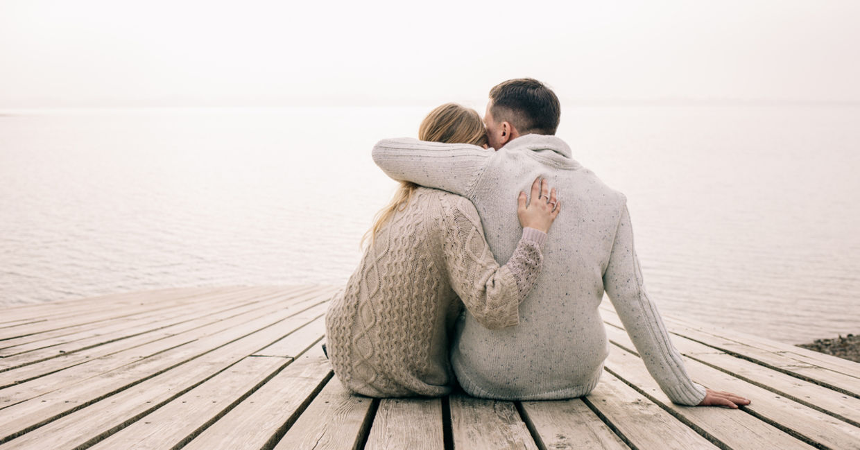 Couple hugging on a pier Couple hugging on a pier