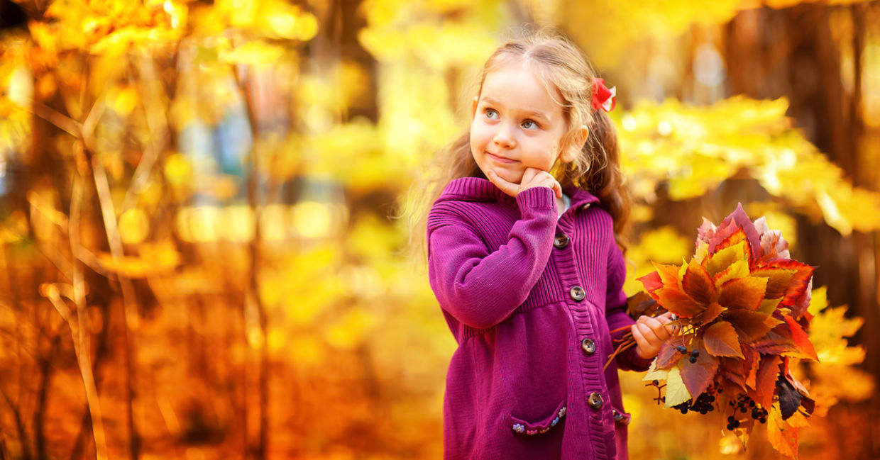 Happy little girl in autumn maple orange leaves Happy little girl in autumn maple orange leaves