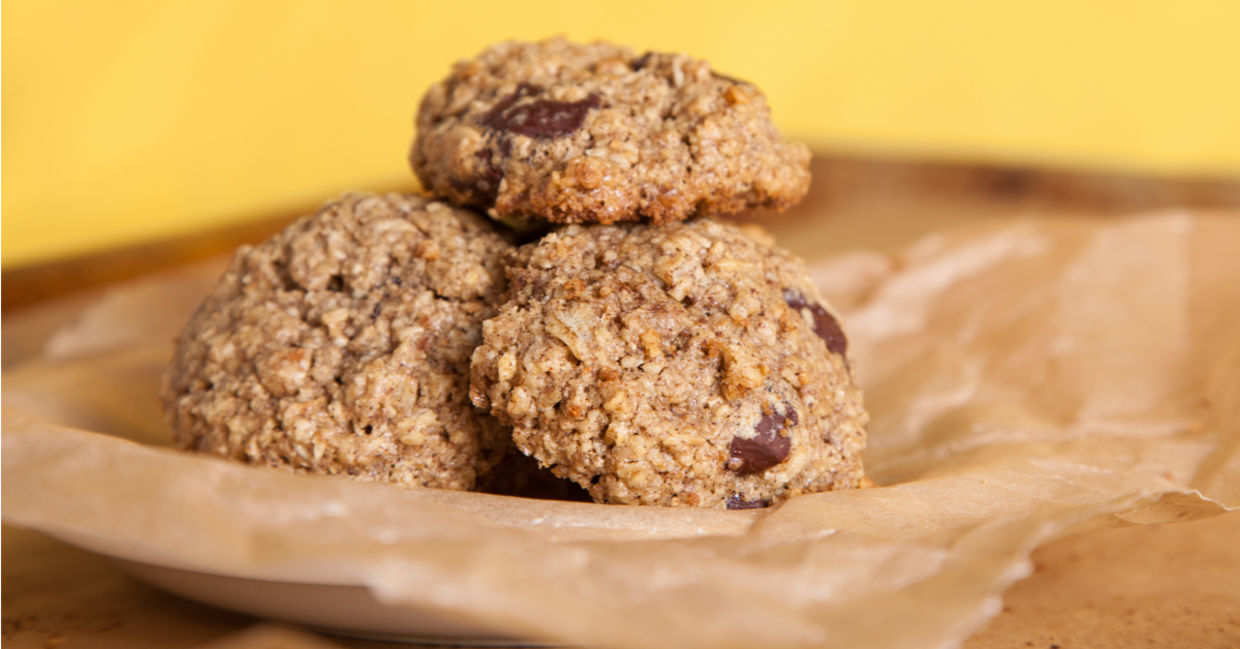 Oven-fresh oatmeal chocolate chip cookies on unbleached parchment paper. Oven-fresh oatmeal chocolate chip cookies on unbleached parchment paper.