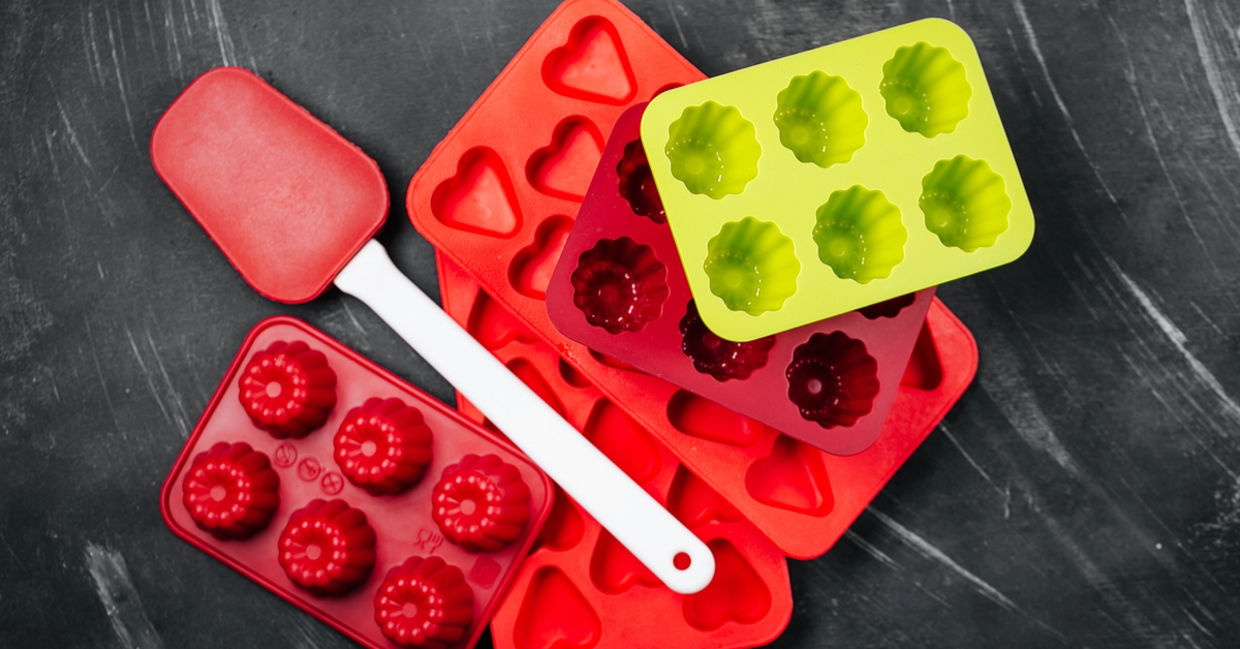Various silicone molds and spatulas, ready for chocolate and candy-making. Various silicone molds and spatulas, ready for chocolate and candy-making.