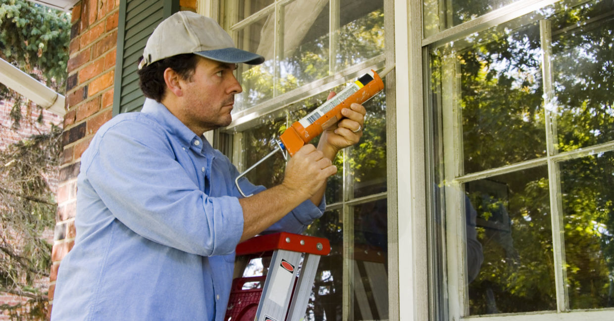 Caulking windows to keep heat in. Caulking windows to keep heat in.