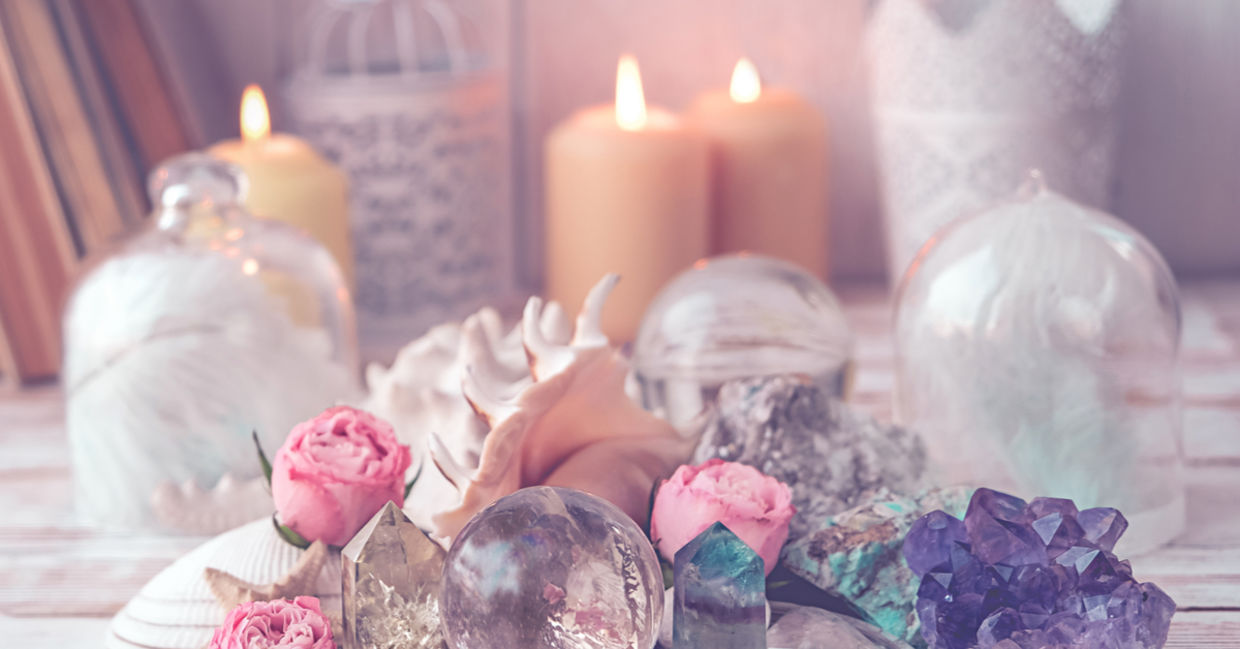 Flickering candles alongside crystals and healing stones are used to manifest dreams. Flickering candles alongside crystals and healing stones are used to manifest dreams.