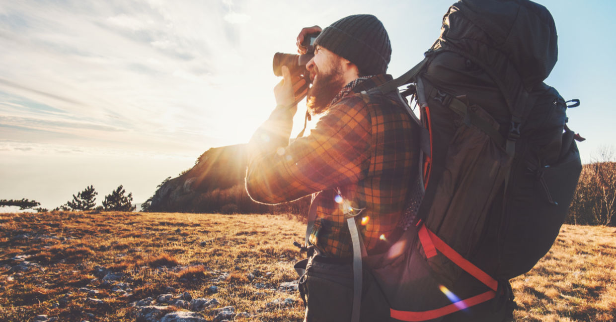 An inspired man pursues his passions by doing travel photography. An inspired man pursues his passions by doing travel photography.