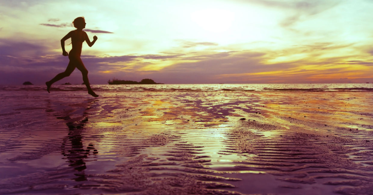 Healthy and mindful woman running on the beach. Healthy and mindful woman running on the beach.