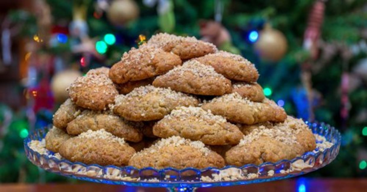 Sugar-coated honey cookies with walnuts is a Greek Christmas treat called melomakarona. Sugar-coated honey cookies with walnuts is a Greek Christmas treat called melomakarona.