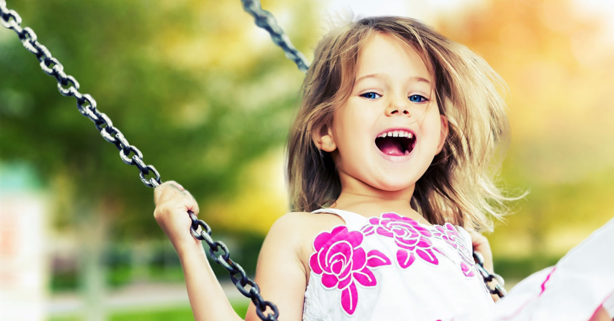 Child swinging. Child swinging.