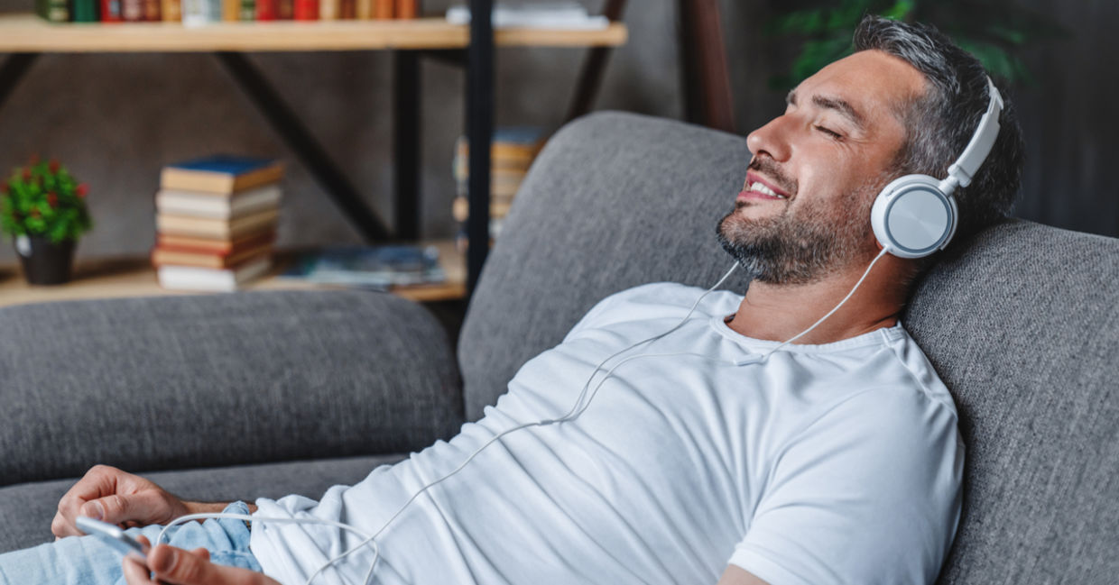 Man listening with headphones. Man listening with headphones.