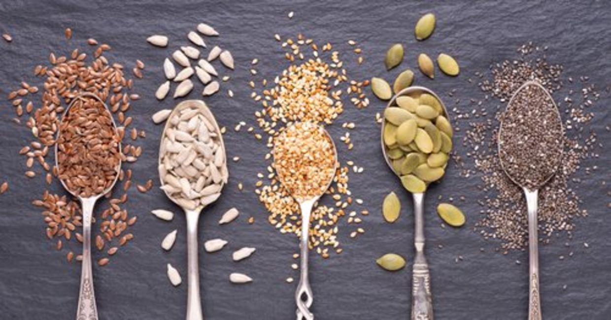 Spoons of healthy flax, chia, pumpkin, sunflower, and sesame seeds. Spoons of healthy flax, chia, pumpkin, sunflower, and sesame seeds.