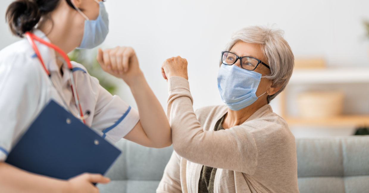 A doctor helps a woman during the COVID 19 pandemic. A doctor helps a woman during the COVID 19 pandemic.