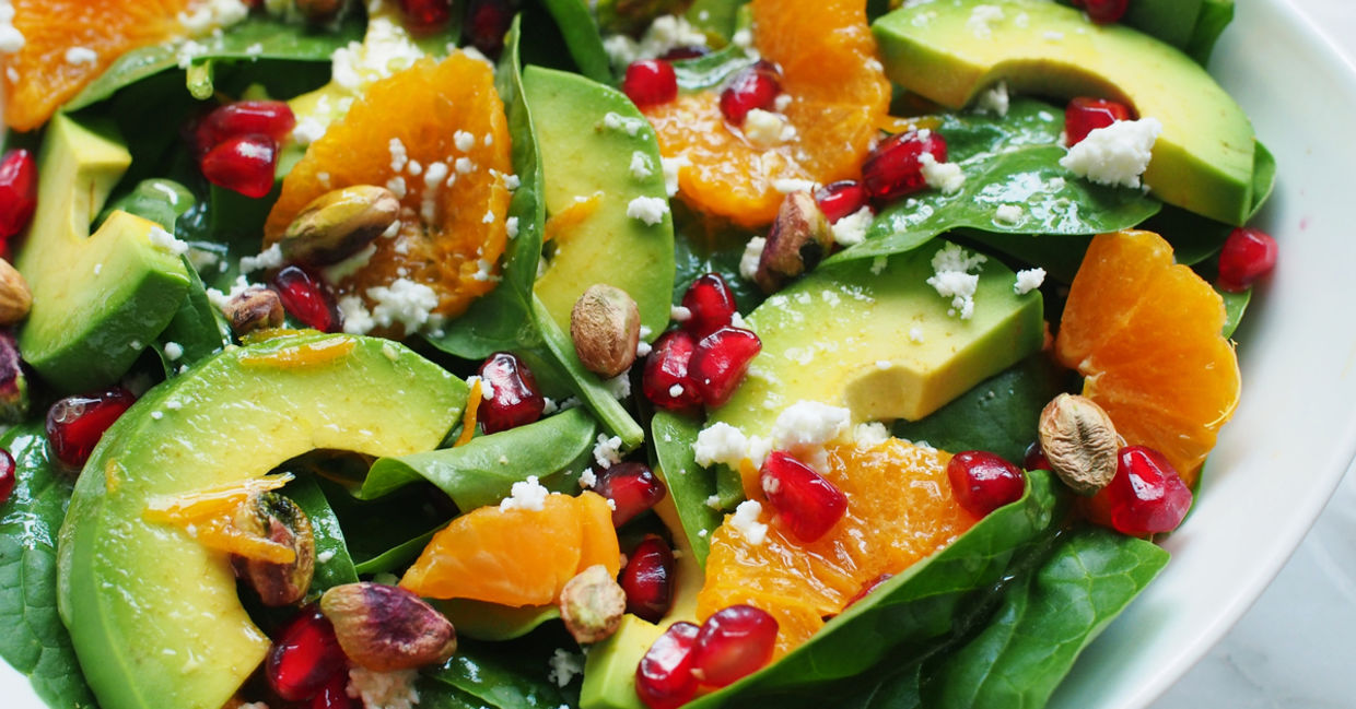 Close-up of spinach and avocado salad. Close-up of spinach and avocado salad.