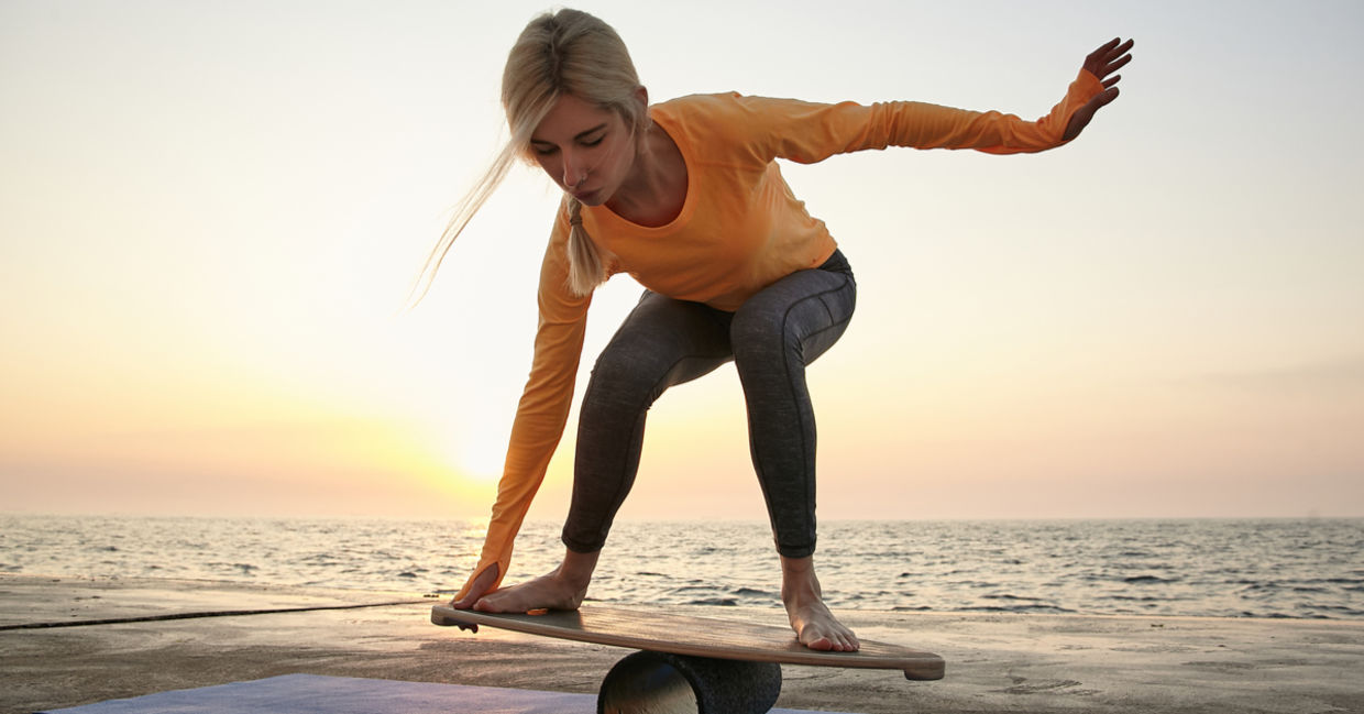 Young woman trying to keep her balance. Young woman trying to keep her balance.
