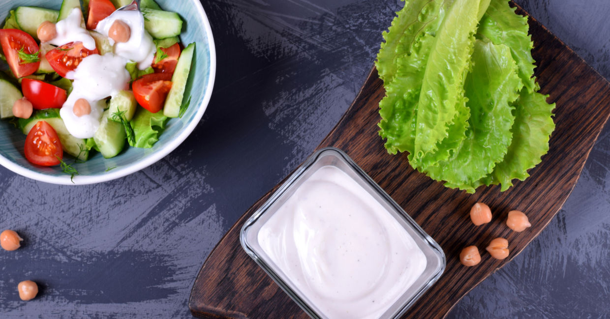 Vegan chickpea mayo made with aquafaba served on vegetables. Vegan chickpea mayo made with aquafaba served on vegetables.