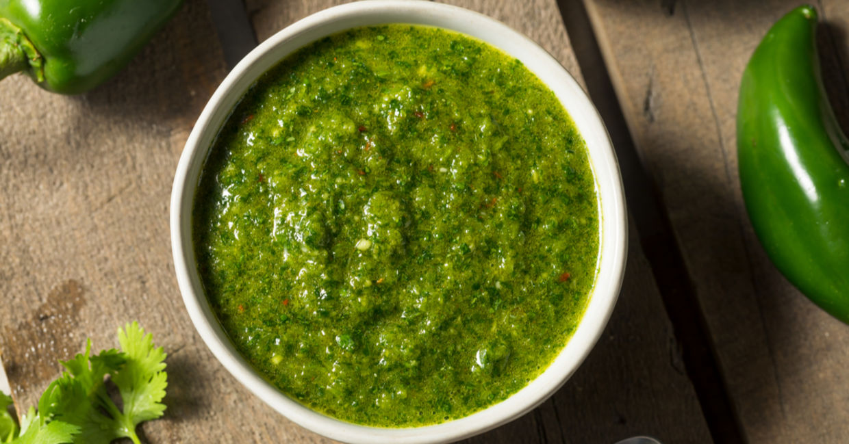 Classic Middle Eastern zhug sauce shown with cilantro and jalapeno peppers. Classic Middle Eastern zhug sauce shown with cilantro and jalapeno peppers.