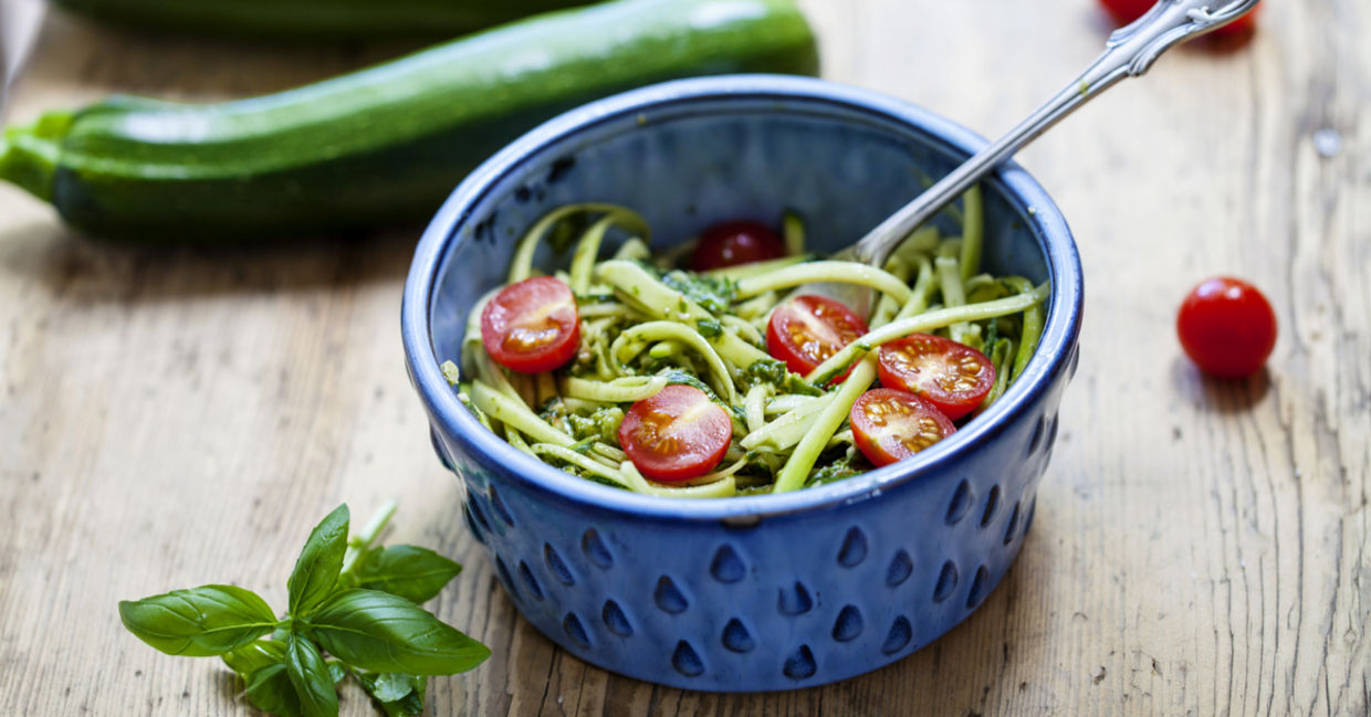 A bowl of vegan zucchini pesto. A bowl of vegan zucchini pesto.