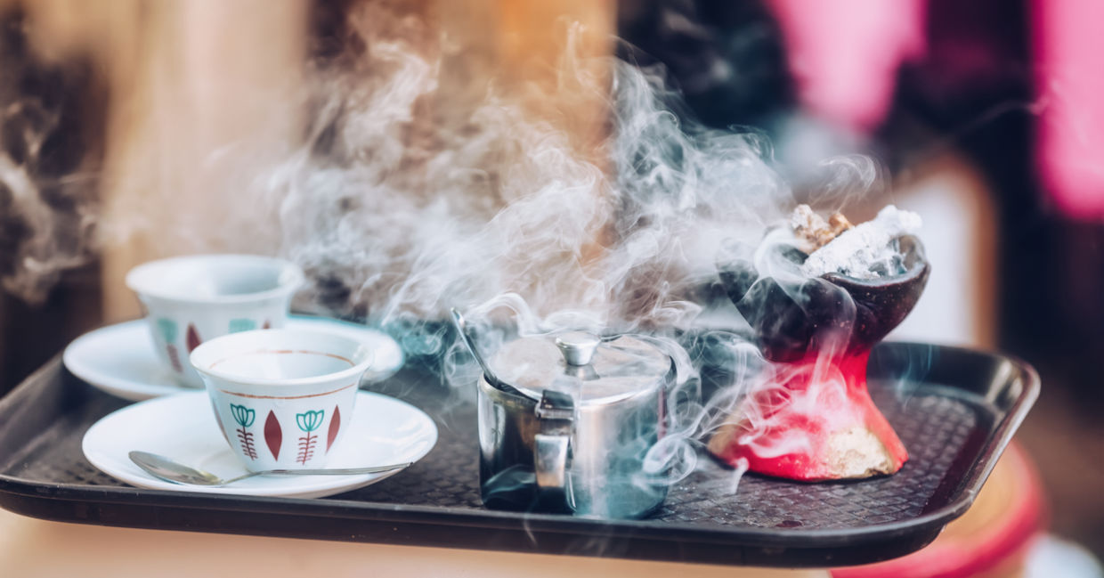 Traditional cup of Ethiopian coffee served with aromatic essence held to ward off bad spirits. Traditional cup of Ethiopian coffee served with aromatic essence held to ward off bad spirits.