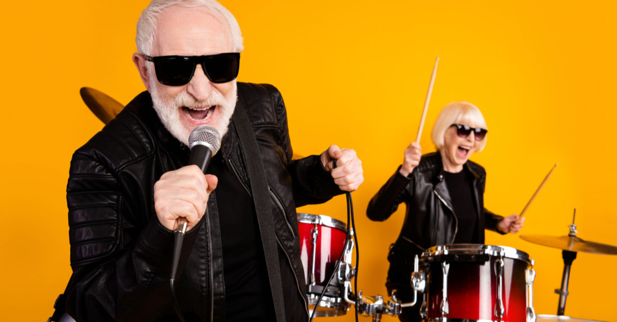 Portrait of cheerful seniors enjoying playing music. Portrait of cheerful seniors enjoying playing music.