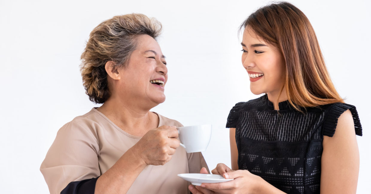 Young woman compassionately caring for an elder family member. Young woman compassionately caring for an elder family member.