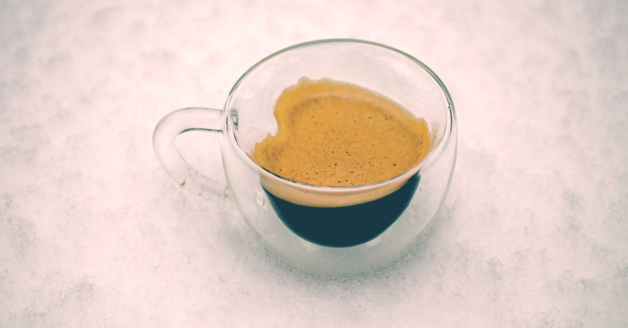 Espresso coffee in a heart-shaped cup to illustrate its health benefits. Espresso coffee in a heart-shaped cup to illustrate its health benefits.
