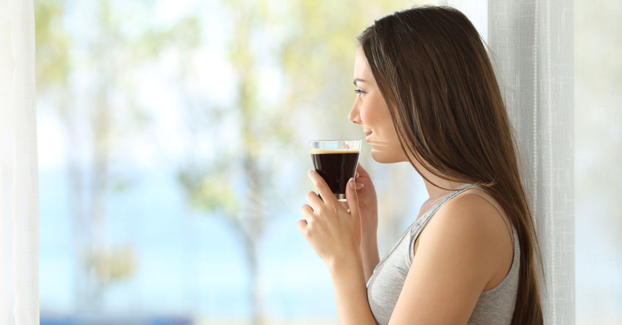 A pensive woman drinking coffee. A pensive woman drinking coffee.