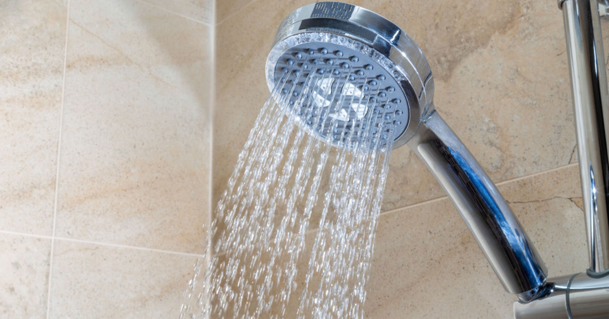 Running water from a shower faucet with a filter. Running water from a shower faucet with a filter.