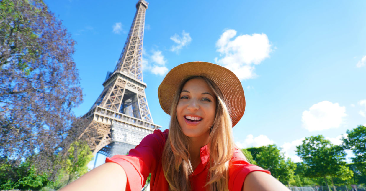 Tourist taking a selfie in Paris. Tourist taking a selfie in Paris.