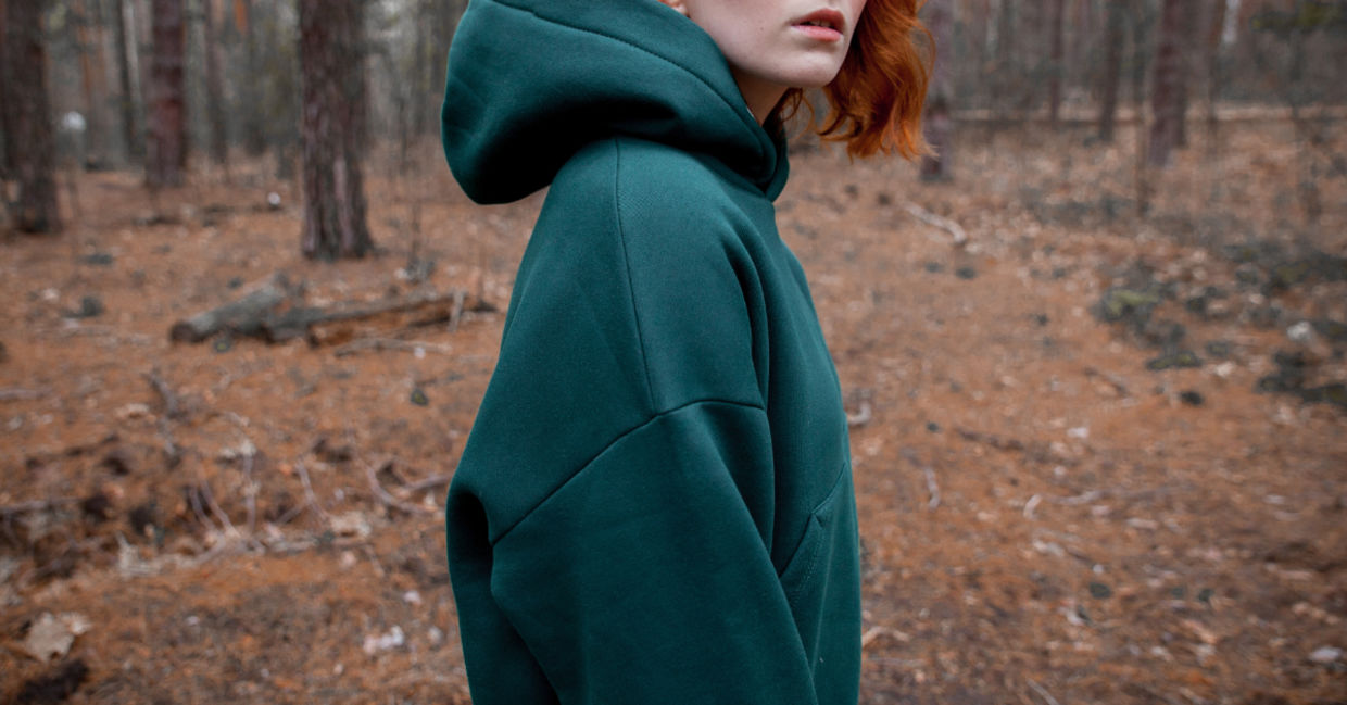 A woman wearing a hoodie. A woman wearing a hoodie.