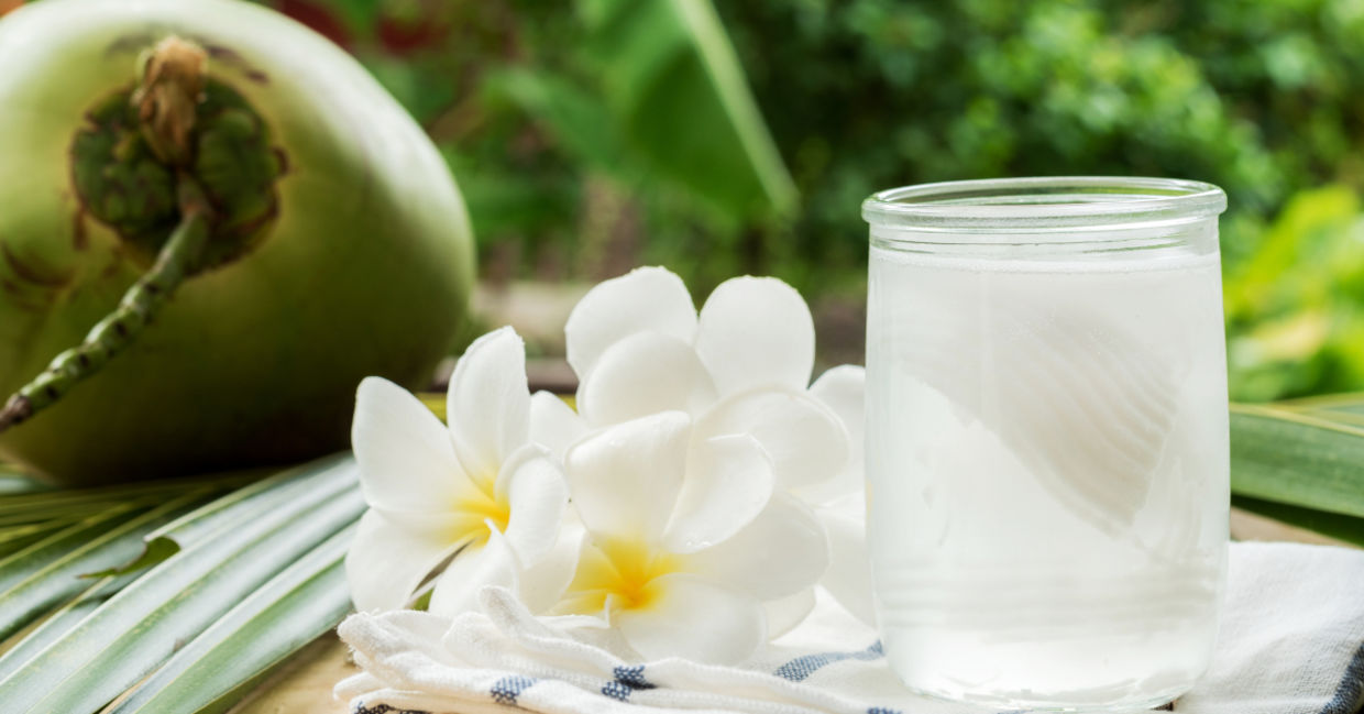 Fresh coconut water with flowers to represent a clear complexion.. Fresh coconut water with flowers to represent a clear complexion..