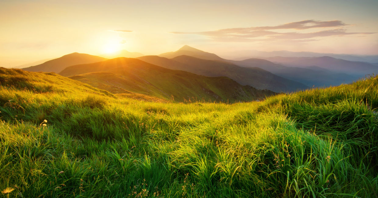 Mountains during sunset in a beautiful natural landscape in the summertime. Mountains during sunset in a beautiful natural landscape in the summertime.