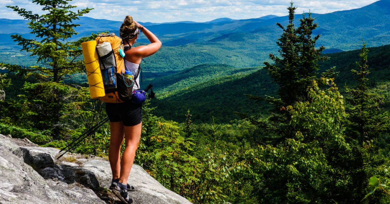 A hiker on the Appalachian trail in Maine A hiker on the Appalachian trail in Maine