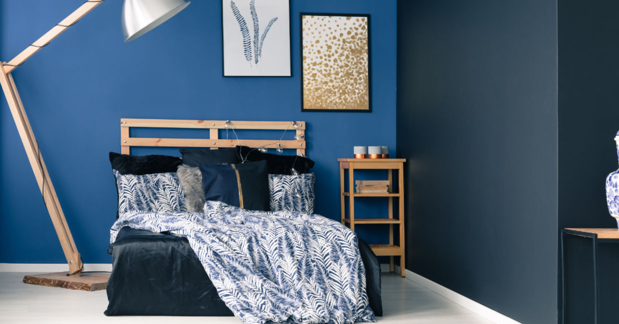 Dark accent wall in a bedroom Dark accent wall in a bedroom