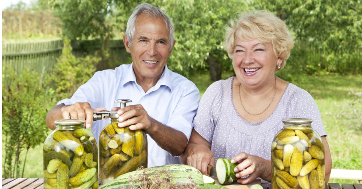 A couple makes DIY homemade pickles. A couple makes DIY homemade pickles.