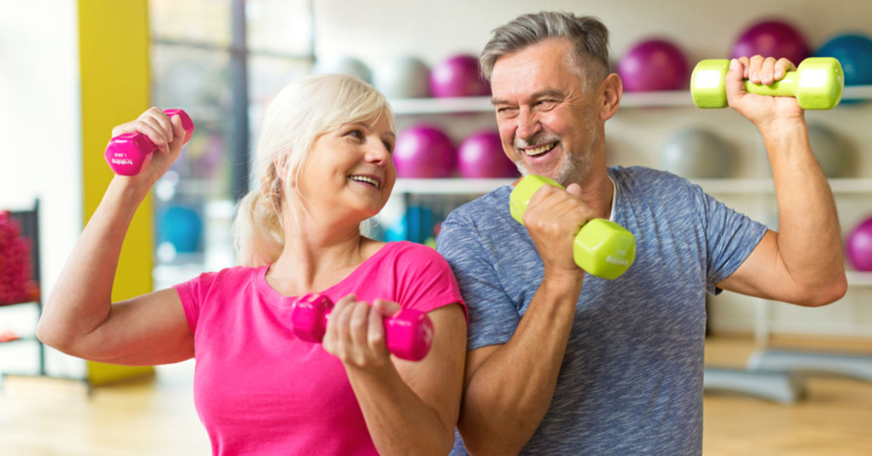 A mature couple lifts weights together, a workout for the body and mind. A mature couple lifts weights together, a workout for the body and mind.