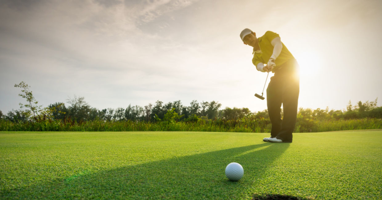 Man playin golf.