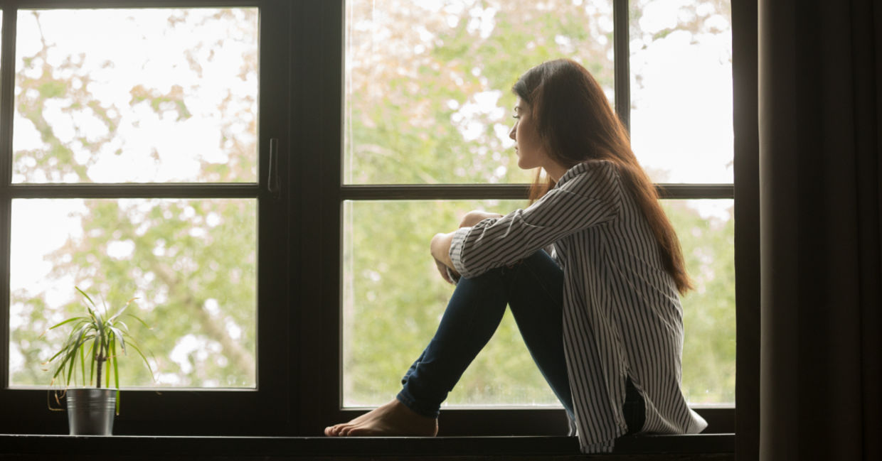 Depressed teenager spending time alone.