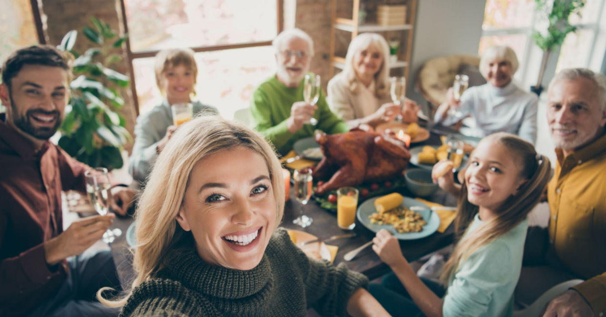 Family enjoying a traditional Thanksgiving feast. Family enjoying a traditional Thanksgiving feast.