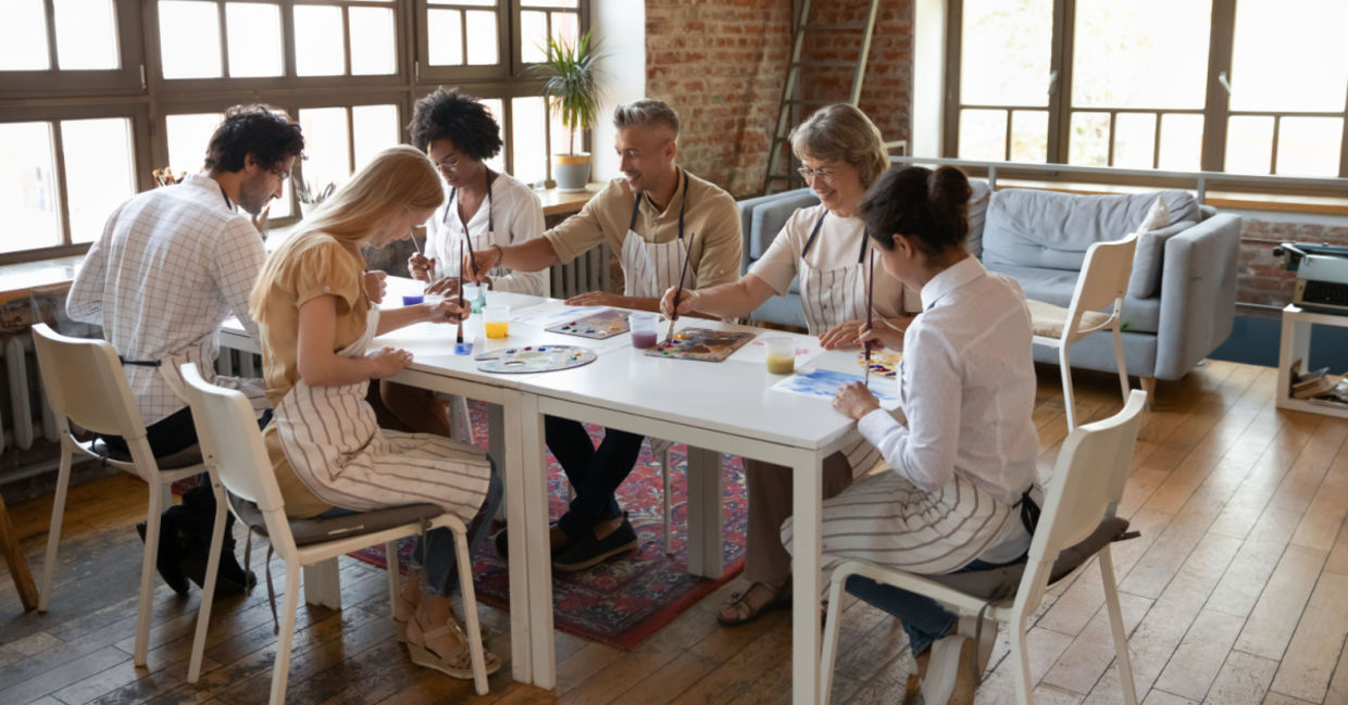 Multi-aged adults taking an art class Multi-aged adults taking an art class