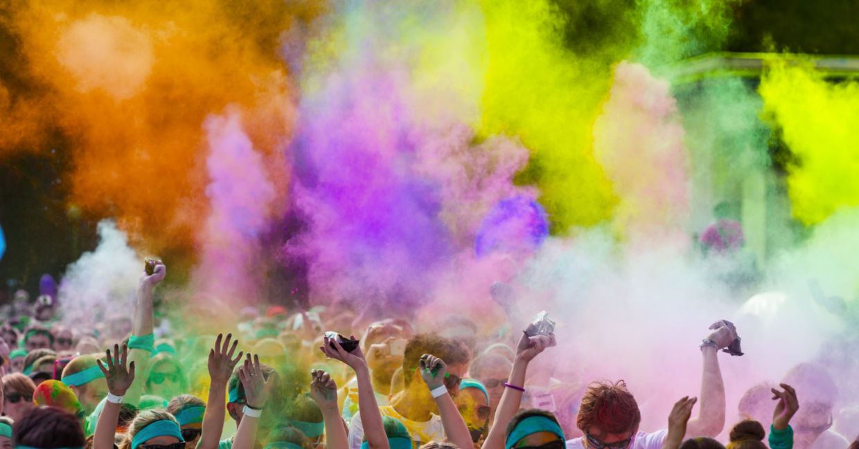 People are covered in colors. People are covered in colors.