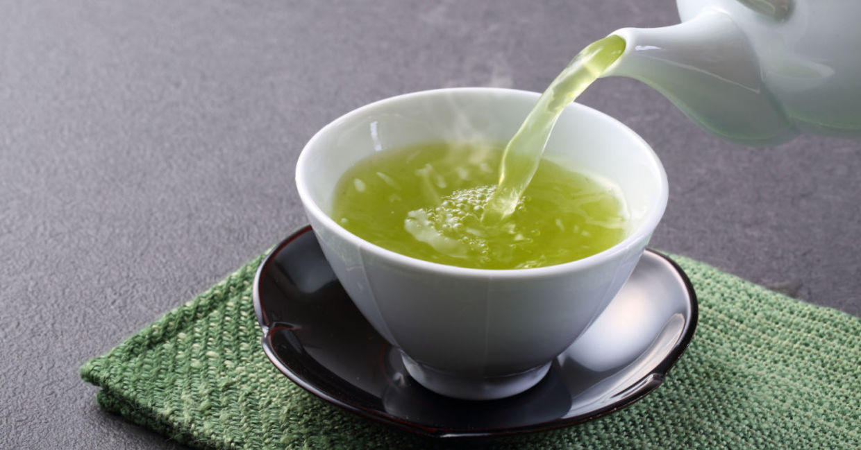 A cup of steaming hot green tea. A cup of steaming hot green tea.